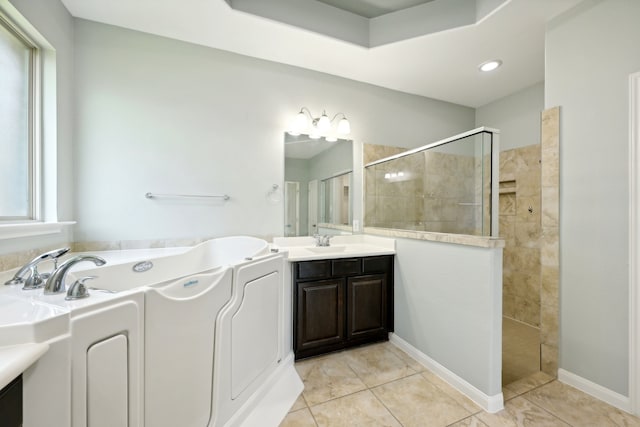 bathroom with tile patterned flooring, vanity, plenty of natural light, and plus walk in shower