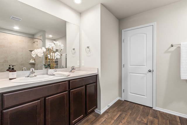 bathroom with vanity and hardwood / wood-style floors