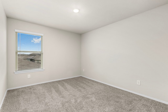 empty room featuring carpet flooring