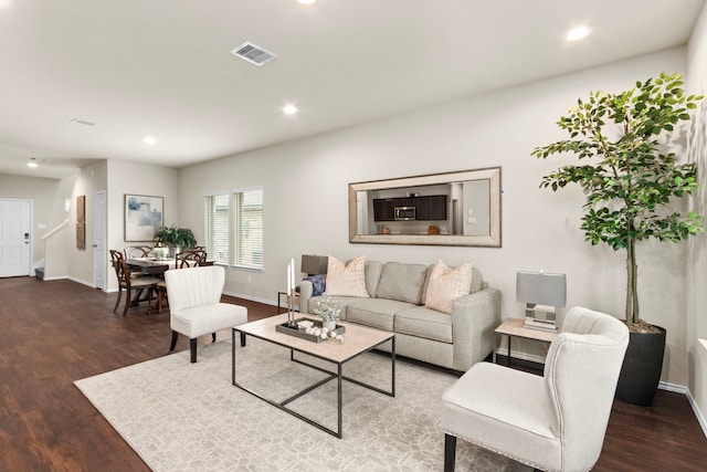 living room with dark wood-type flooring