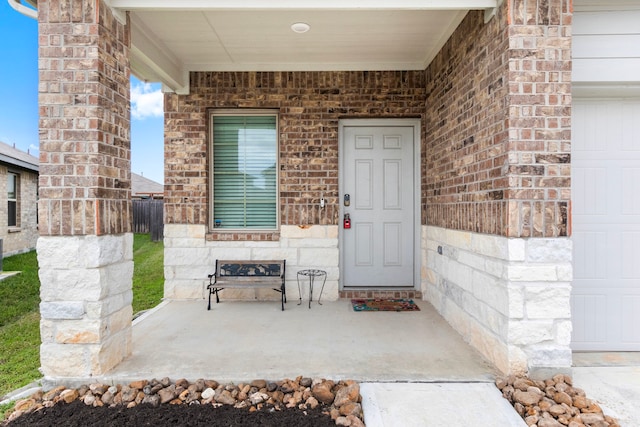 entrance to property featuring a porch