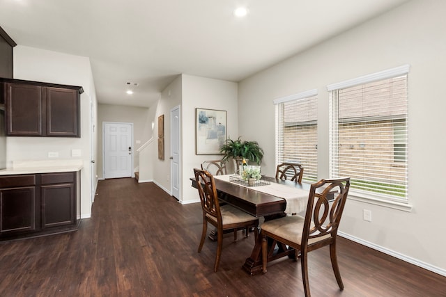 dining room with dark hardwood / wood-style floors