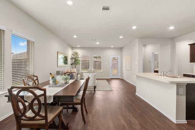 dining area featuring dark hardwood / wood-style floors and sink