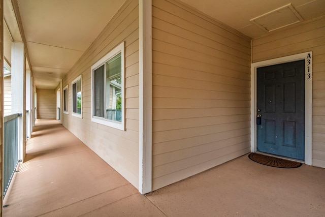 12800 Melville Dr Unit A313, Montgomery, TX 77356 - view of exterior entry featuring a porch