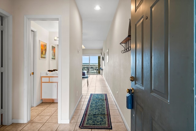 corridor with light tile patterned flooring