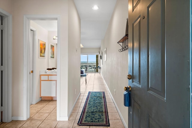 12800 Melville Dr Unit A313, Montgomery, TX 77356 - hall with light tile patterned floors and baseboards