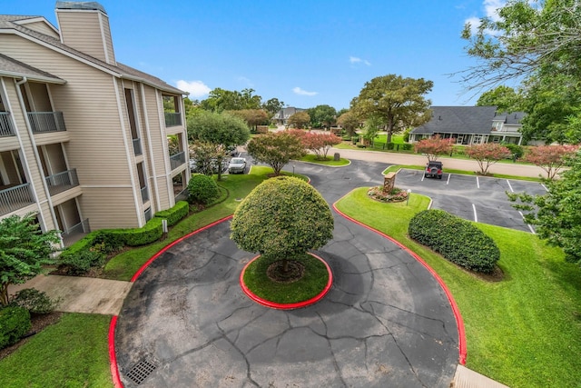 12800 Melville Dr Unit A313, Montgomery, TX 77356 - view of home's community featuring uncovered parking and a yard