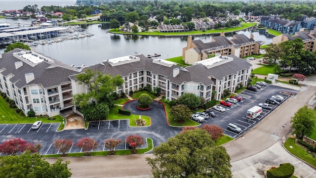 birds eye view of property featuring a water view