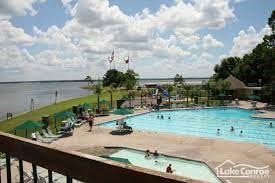 view of pool featuring a water view