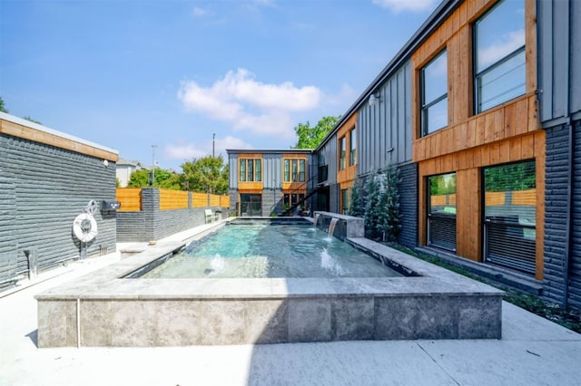 view of pool featuring pool water feature