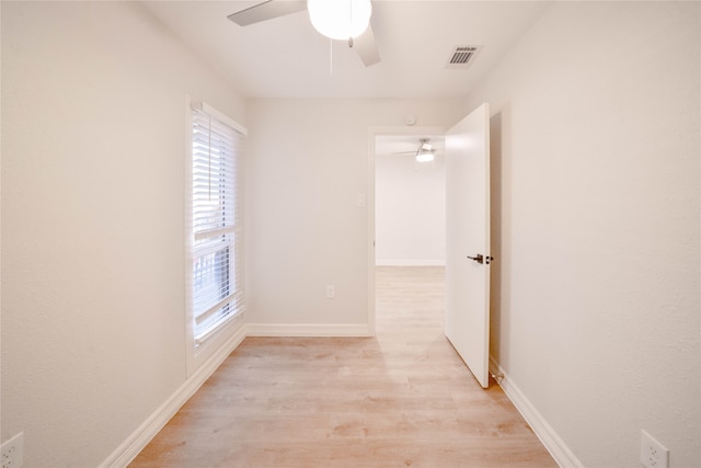 unfurnished room with ceiling fan and light hardwood / wood-style floors