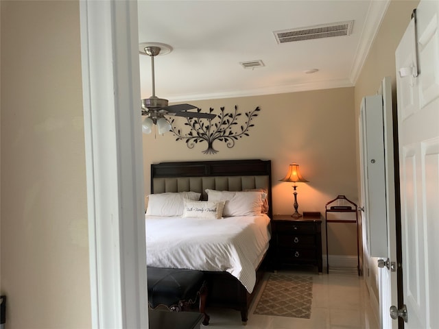 tiled bedroom featuring ceiling fan and ornamental molding