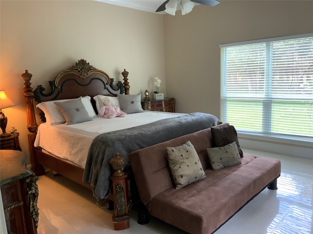 bedroom with multiple windows and ceiling fan