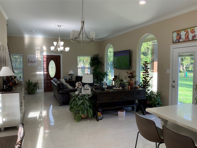 tiled living room featuring crown molding and a chandelier