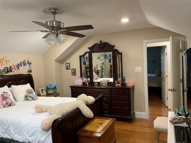 bedroom featuring lofted ceiling, hardwood / wood-style floors, and ceiling fan