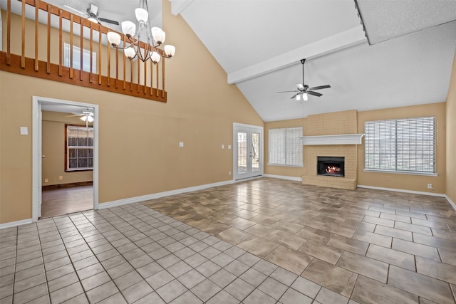 unfurnished living room featuring ceiling fan with notable chandelier, a fireplace, beam ceiling, and light tile patterned flooring