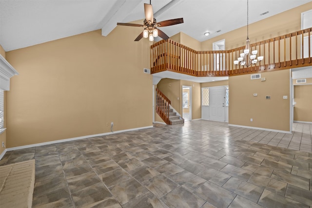 unfurnished living room with ceiling fan with notable chandelier, dark tile patterned flooring, beamed ceiling, and high vaulted ceiling