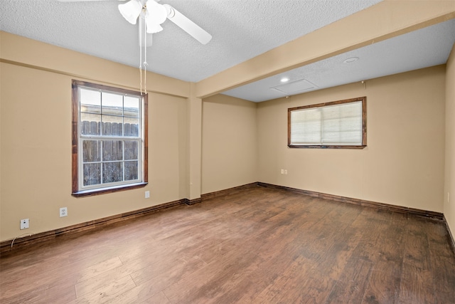 unfurnished room with hardwood / wood-style floors, ceiling fan, and a textured ceiling