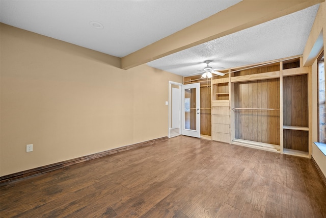 unfurnished bedroom featuring hardwood / wood-style floors, a closet, ceiling fan, beam ceiling, and a textured ceiling