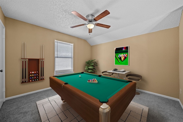 rec room featuring pool table, vaulted ceiling, carpet flooring, ceiling fan, and a textured ceiling