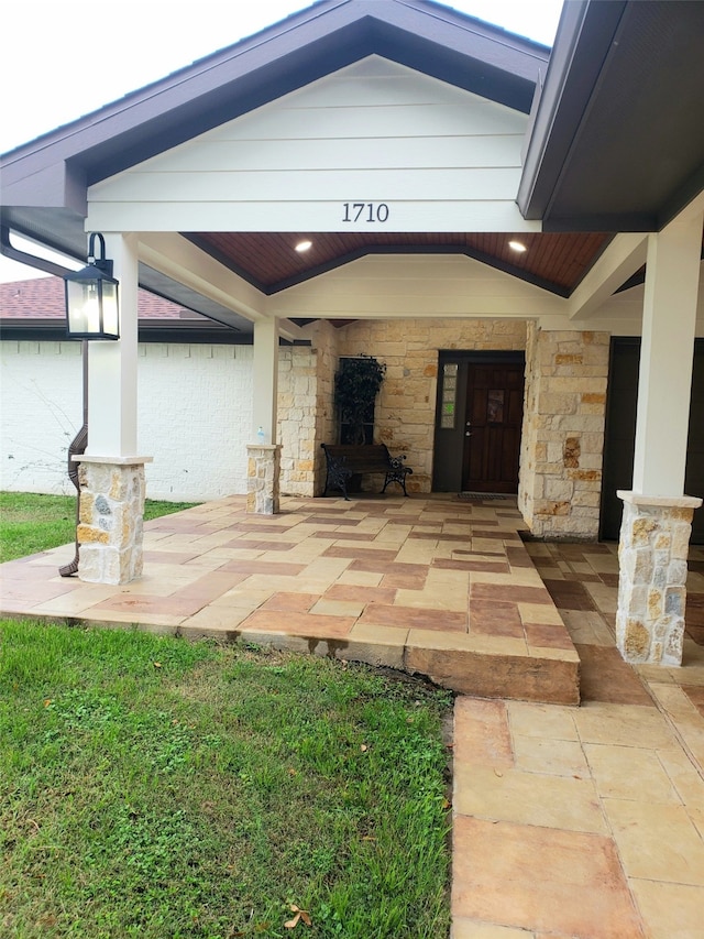 property entrance featuring a patio