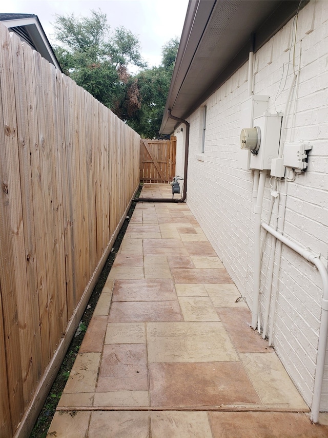 view of side of property with a patio