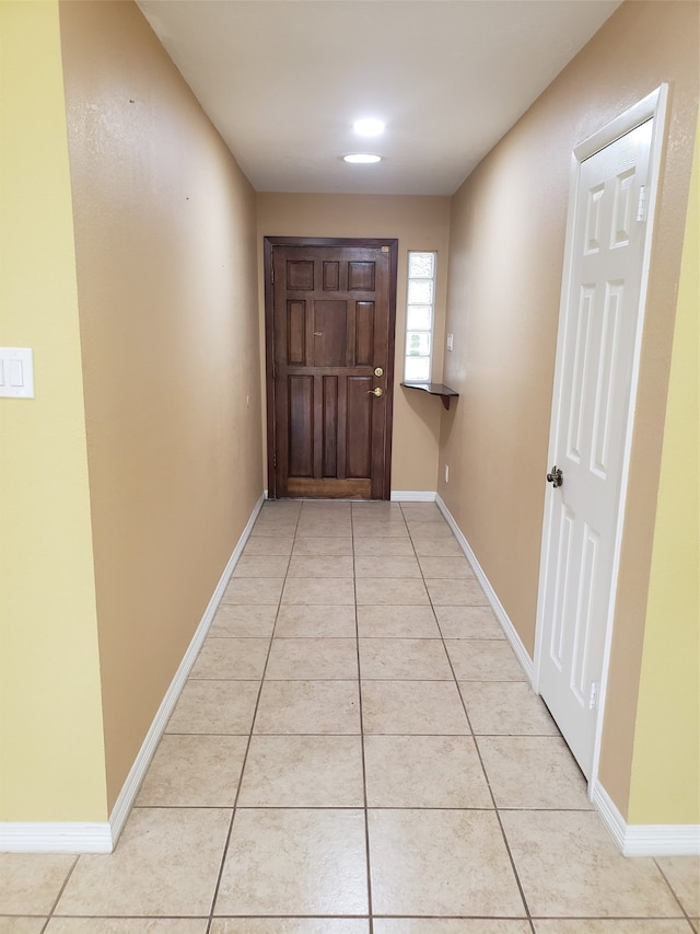 doorway featuring light tile patterned floors