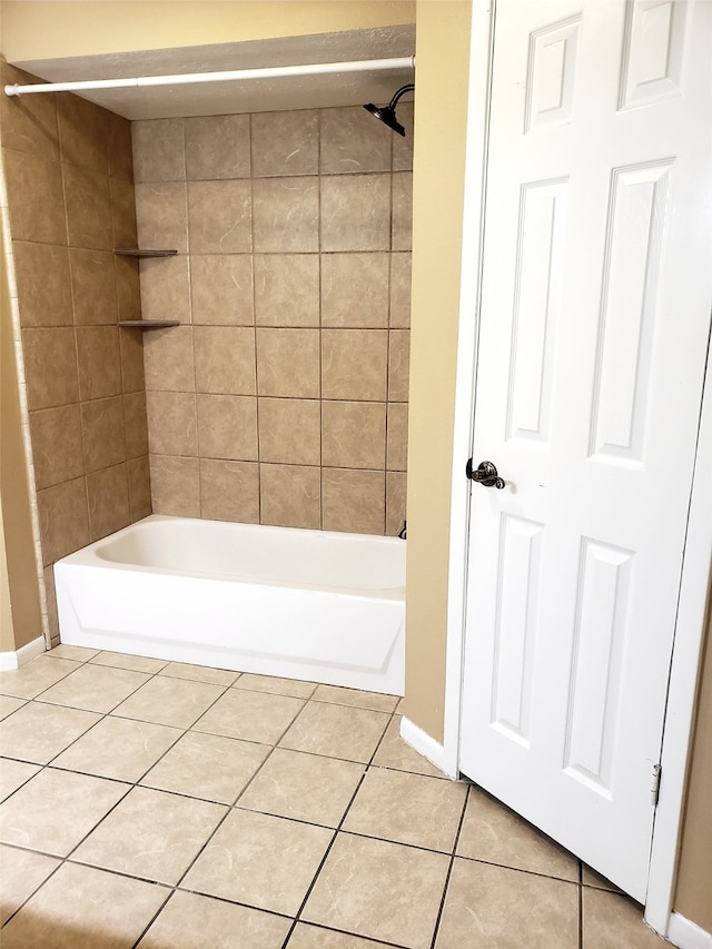 bathroom with tile patterned flooring and tiled shower / bath combo