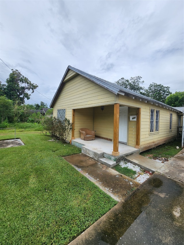 view of home's exterior featuring a lawn