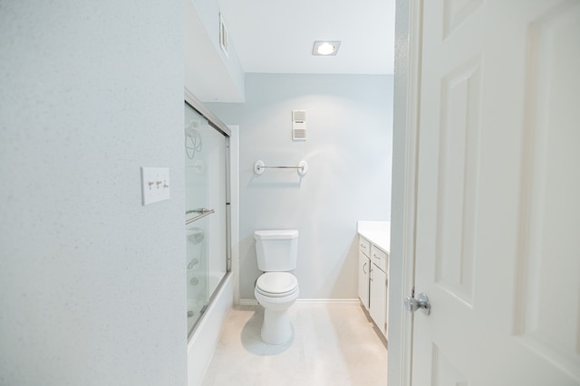 full bathroom with enclosed tub / shower combo, vanity, and toilet