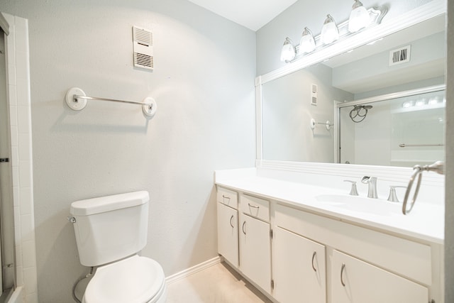 bathroom with walk in shower, vanity, and toilet