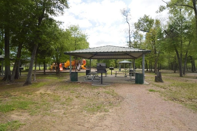 view of property's community featuring a playground and a gazebo