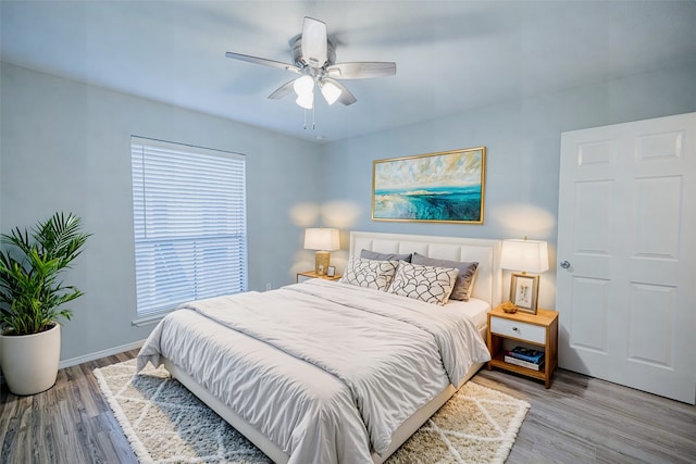 bedroom featuring ceiling fan and wood-type flooring