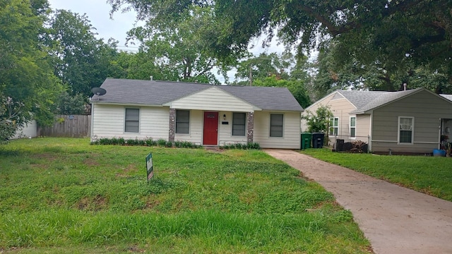 ranch-style house with a front lawn