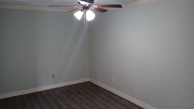 empty room featuring ceiling fan, dark hardwood / wood-style floors, and crown molding