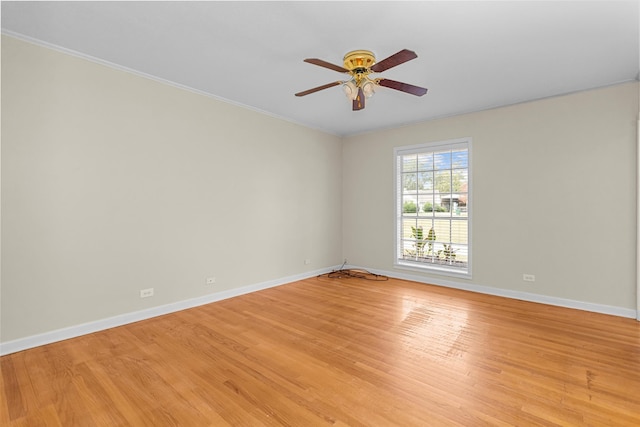 spare room featuring ceiling fan, crown molding, and light hardwood / wood-style flooring