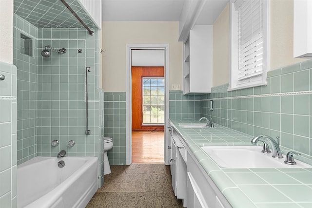 full bathroom featuring vanity, toilet, tile walls, and wood-type flooring