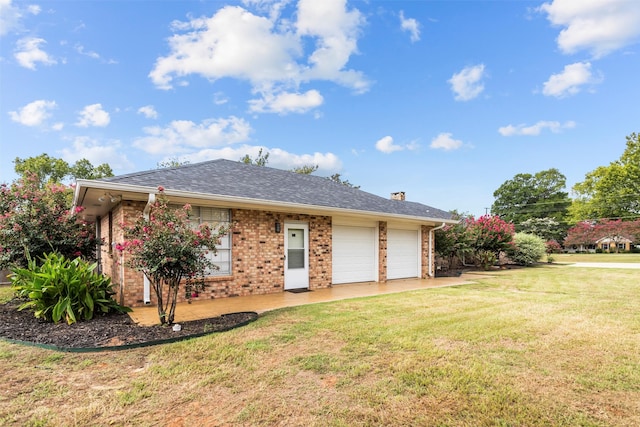 exterior space with a front lawn and a garage