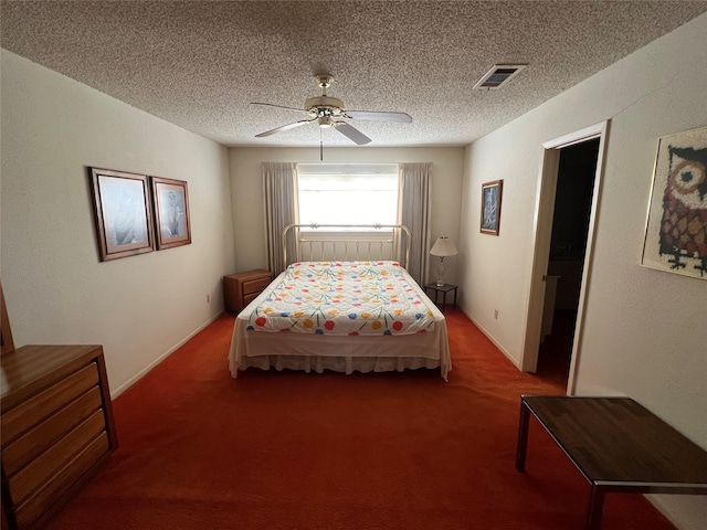 bedroom with a textured ceiling, ceiling fan, and carpet flooring