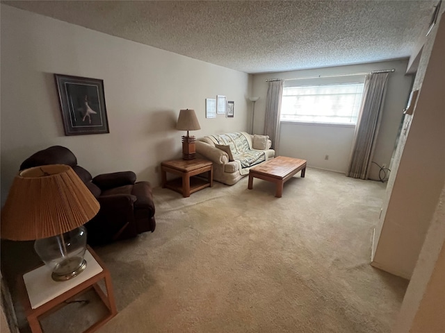 carpeted living room featuring a textured ceiling