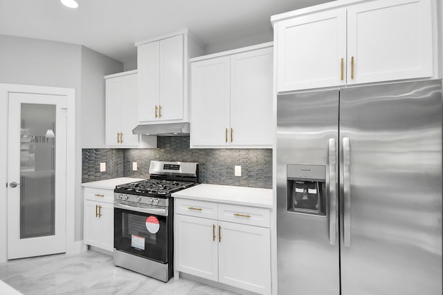 kitchen featuring stainless steel appliances, white cabinets, and decorative backsplash