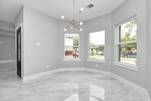 unfurnished dining area featuring an inviting chandelier