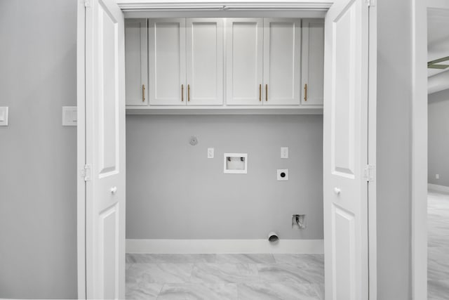 laundry area with hookup for a washing machine, cabinets, hookup for a gas dryer, and electric dryer hookup