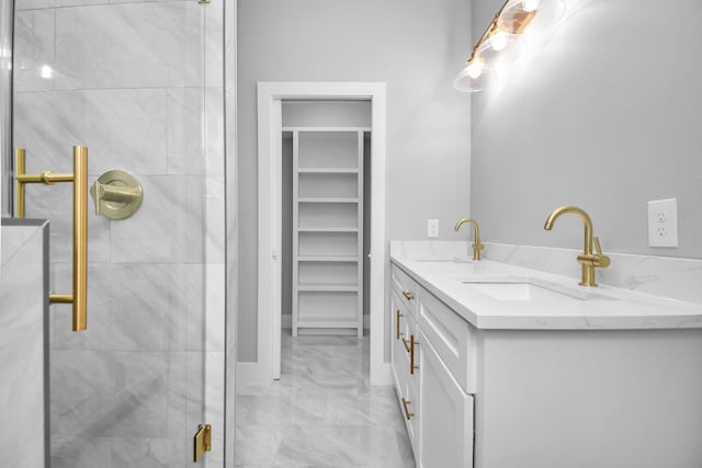 bathroom with an enclosed shower and vanity