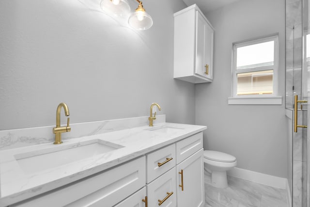 bathroom with toilet and vanity