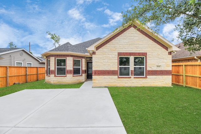 back of property featuring a yard and a patio