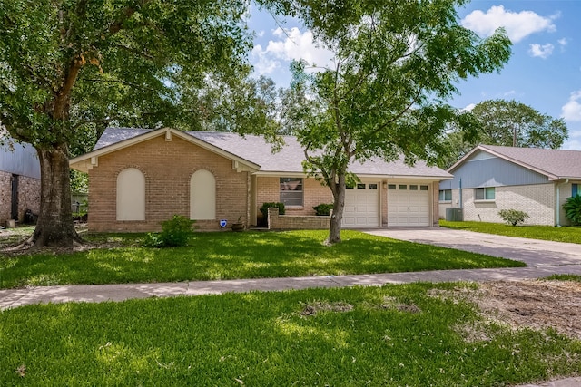 single story home featuring a garage, a front yard, and central air condition unit