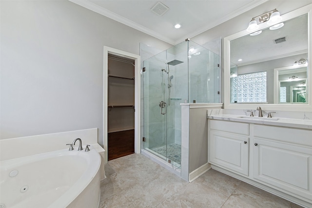 bathroom featuring vanity, crown molding, and shower with separate bathtub