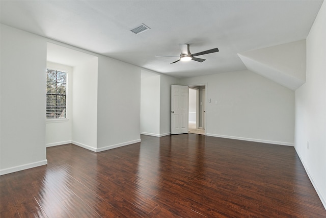 unfurnished room featuring ceiling fan, dark hardwood / wood-style floors, and lofted ceiling