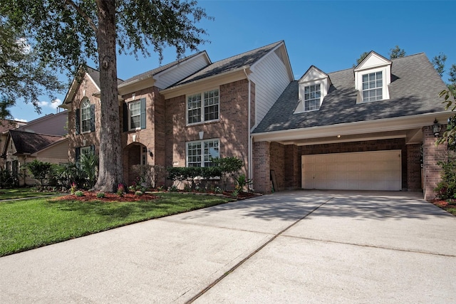 view of front of home with a garage and a front yard